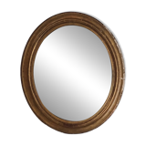 Antique oval gilded stucco mirror