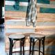 Set of 2 high bar stools made of wicker and rattan cane.