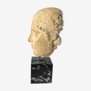 Ancient head on its marble base