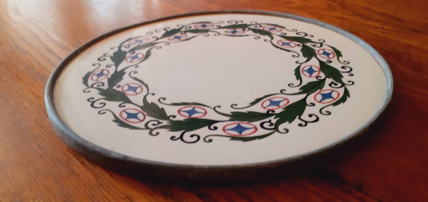 Porcelain and zinc trivet circa 1900