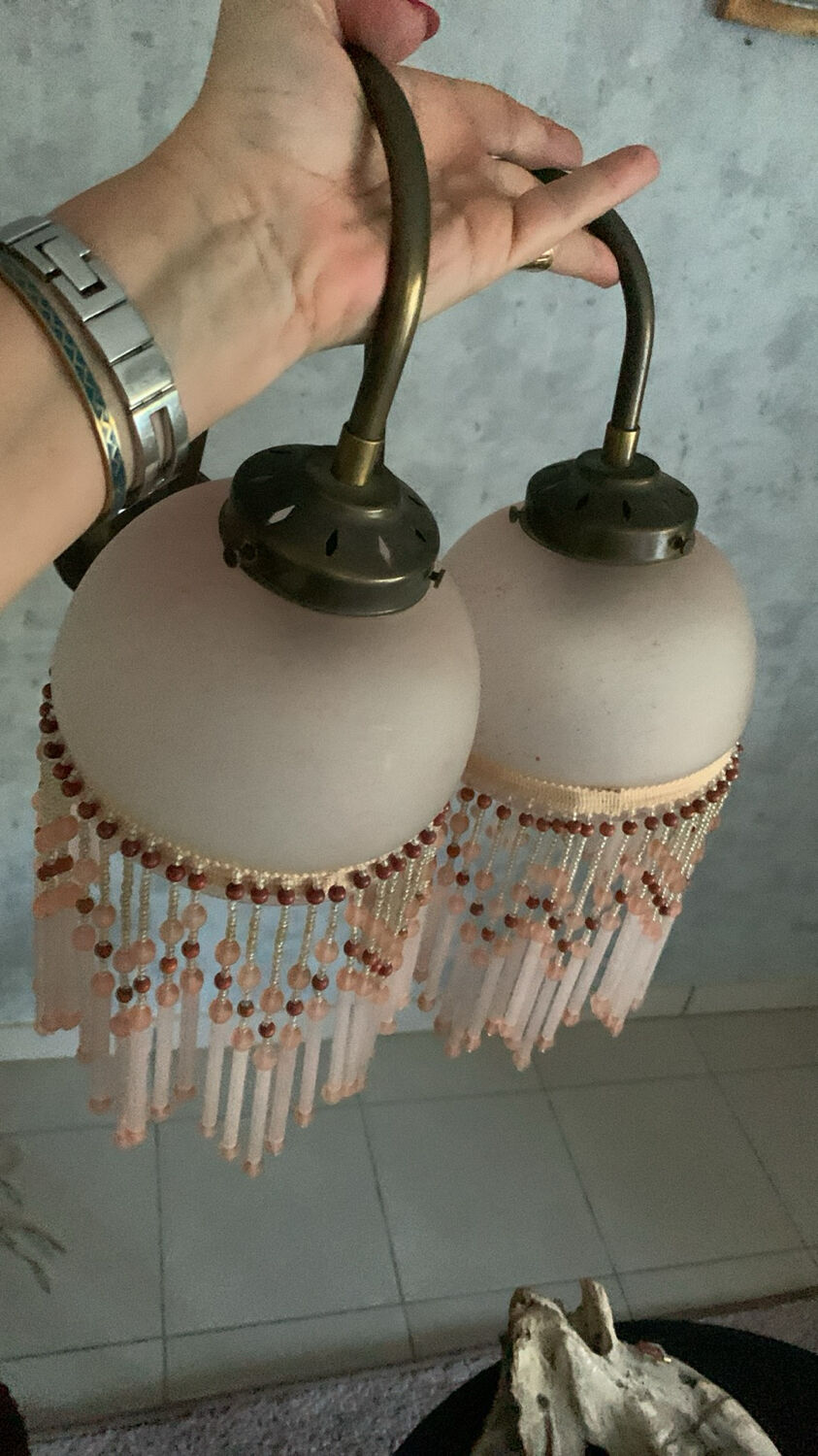 Pair of wall sconces in pink glass and pendants.