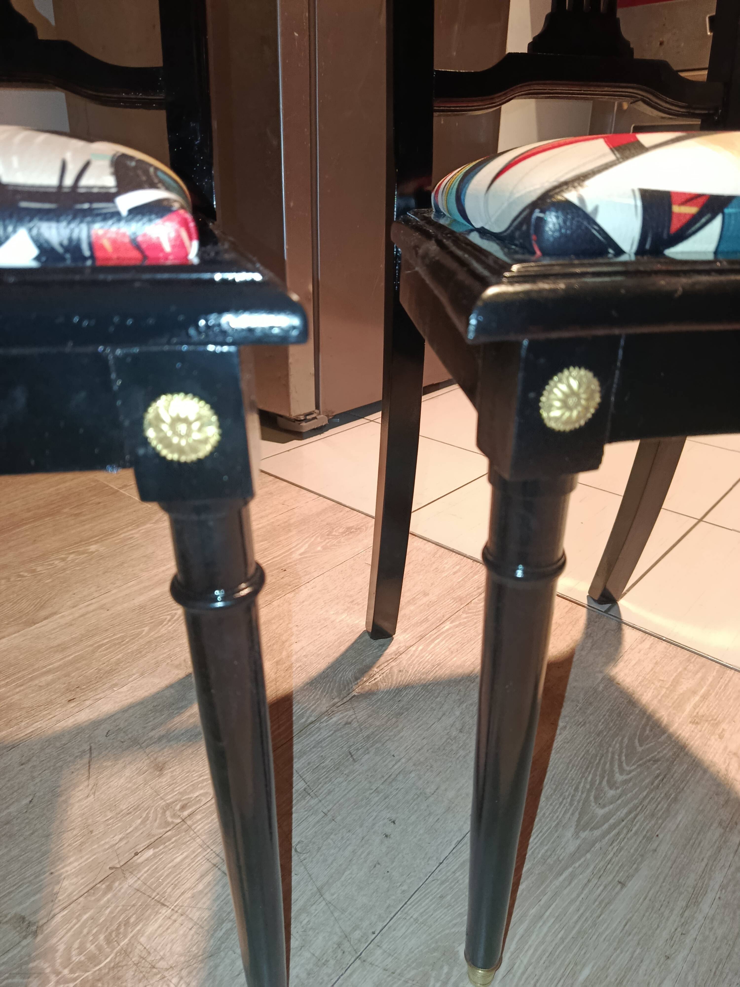 Pair of Hepplewhite neoclassical style chairs, relooked in black lacquer and faux leather.