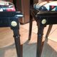 Pair of Hepplewhite neoclassical style chairs, relooked in black lacquer and faux leather.
