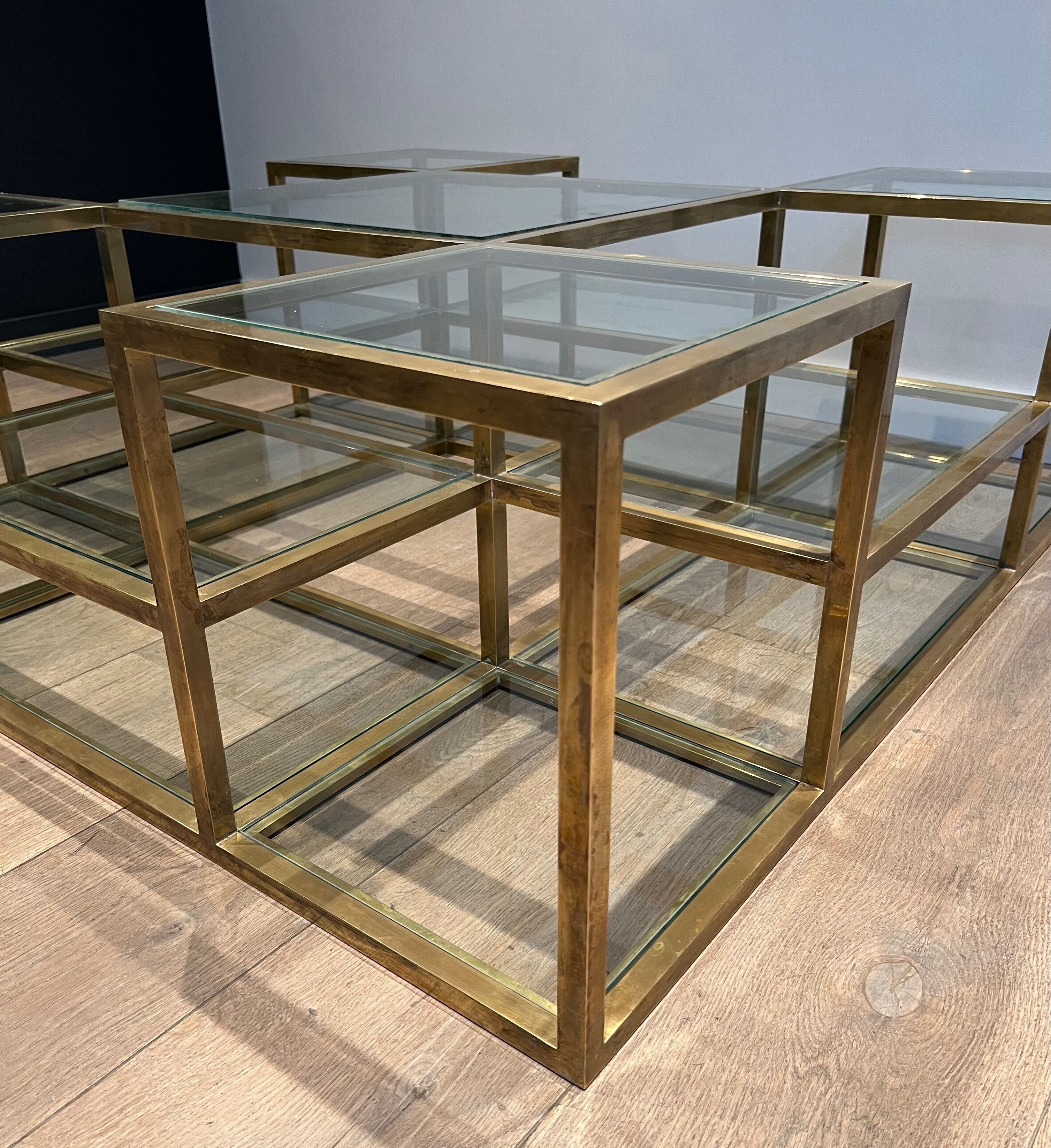 Important brass coffee table with multiple levels.