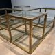 Important brass coffee table with multiple levels.