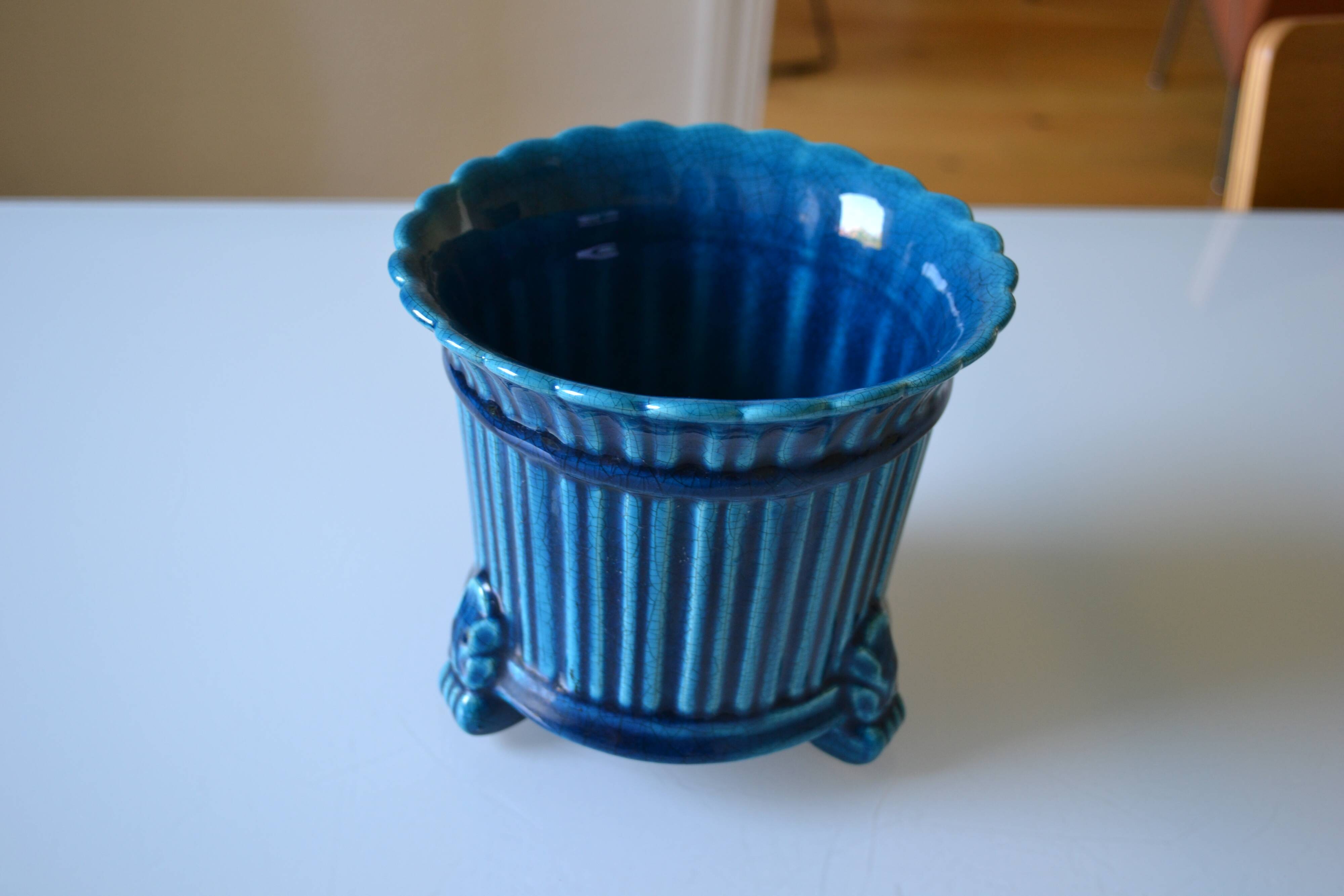 Cracked blue ceramic cache pot