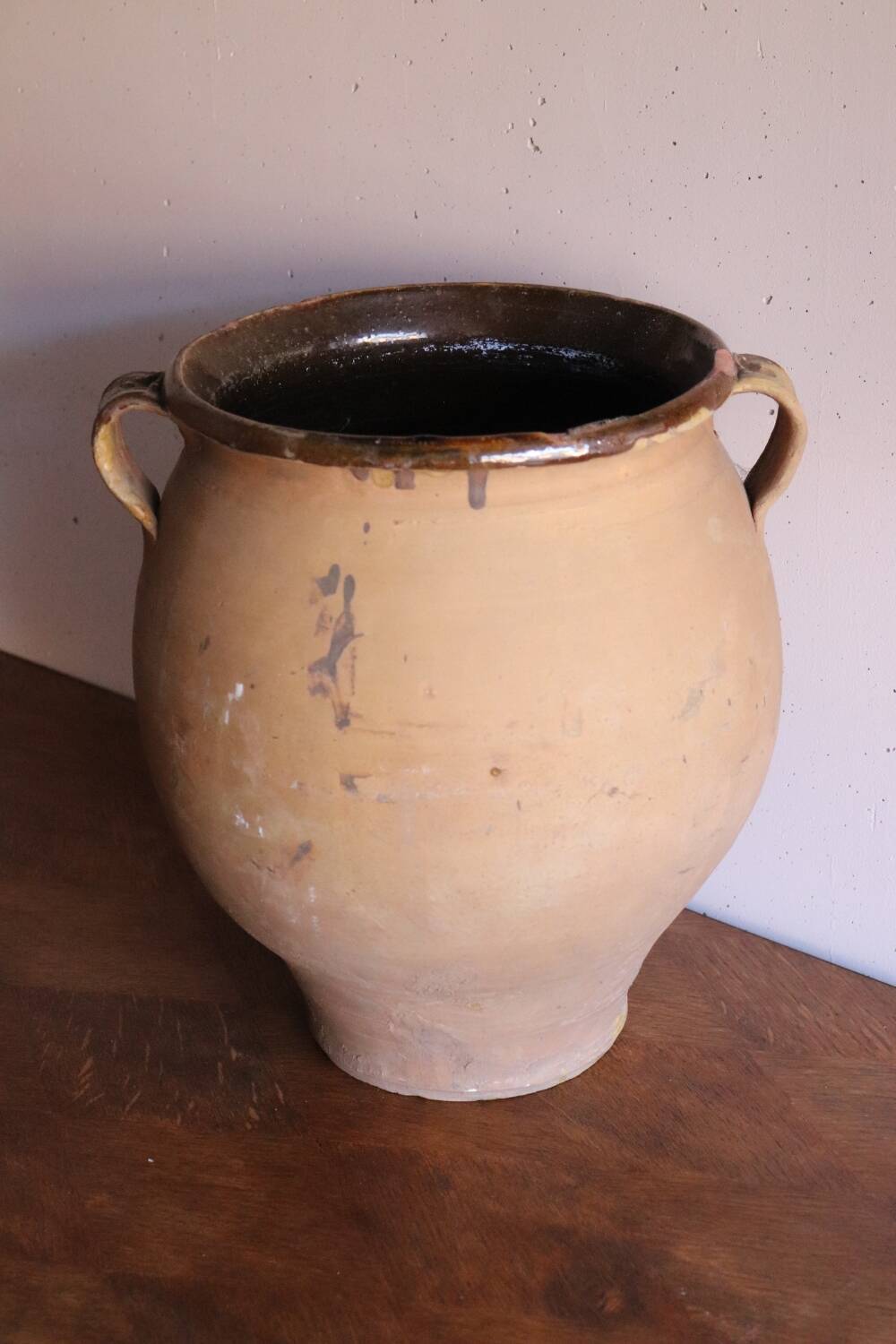 Old glazed terracotta olive jar