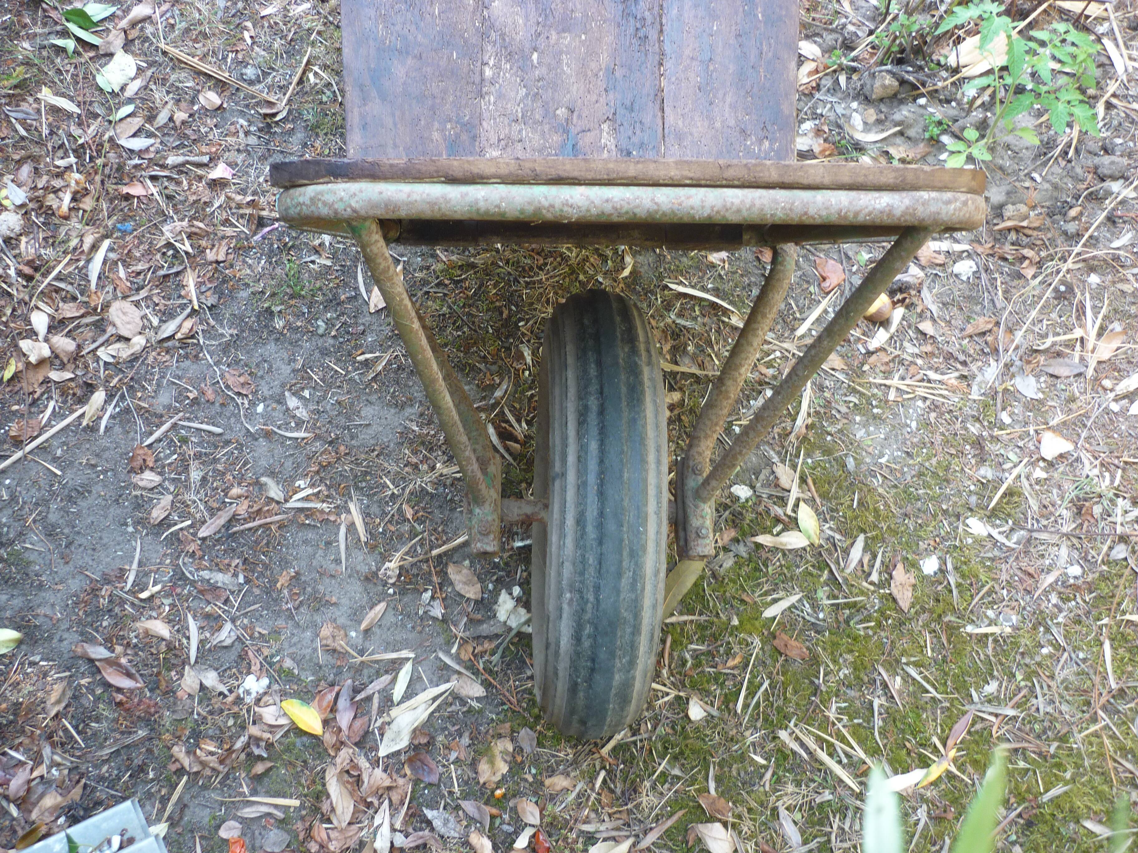 Former wooden and metal wheelbarrow