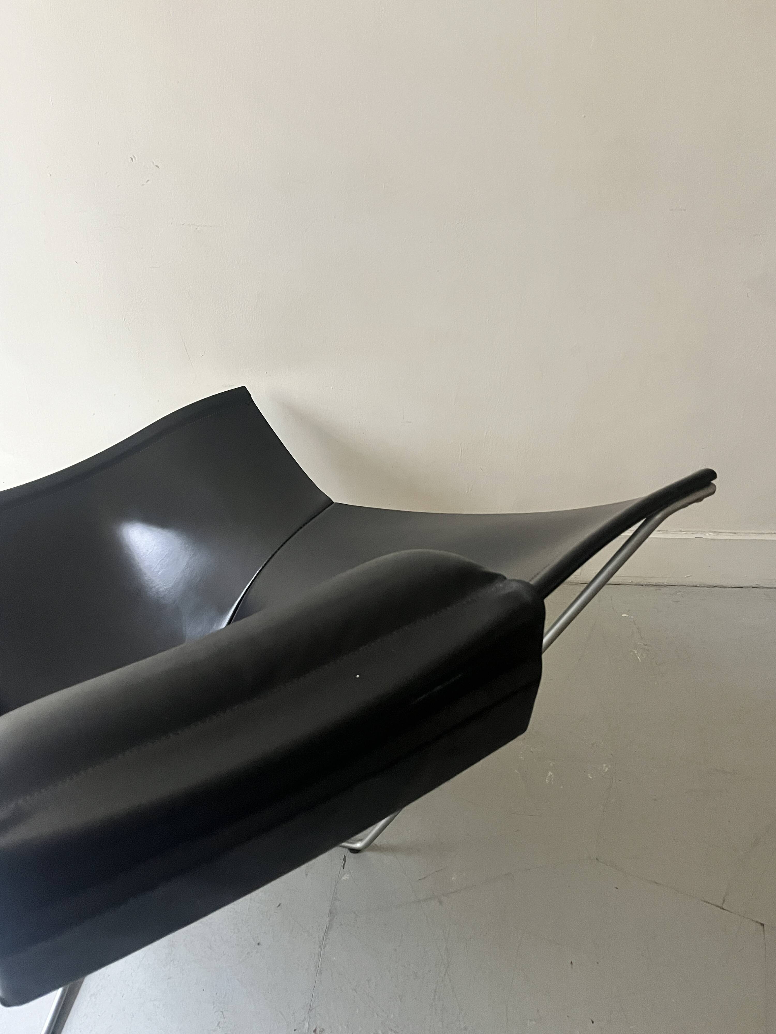 Design armchair Semana in black leather and steel by D. Weeks, limited edition 1980.