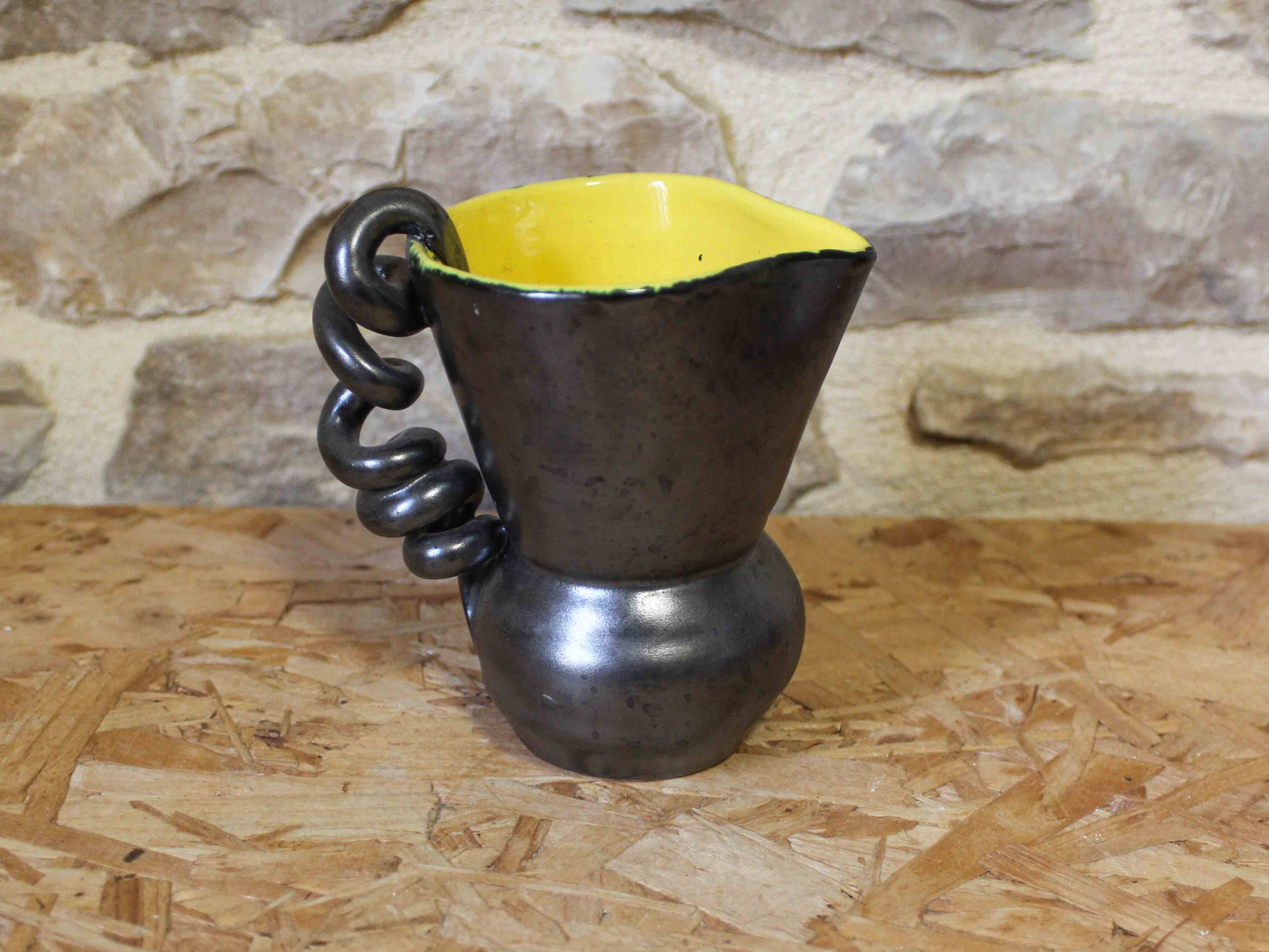Ceramic jug with a twisted handle