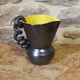 Ceramic jug with a twisted handle