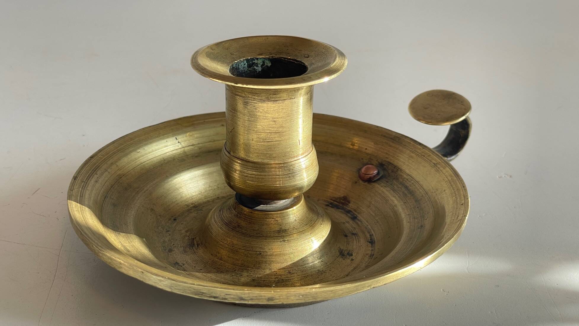 Antique solid bronze hand candlestick