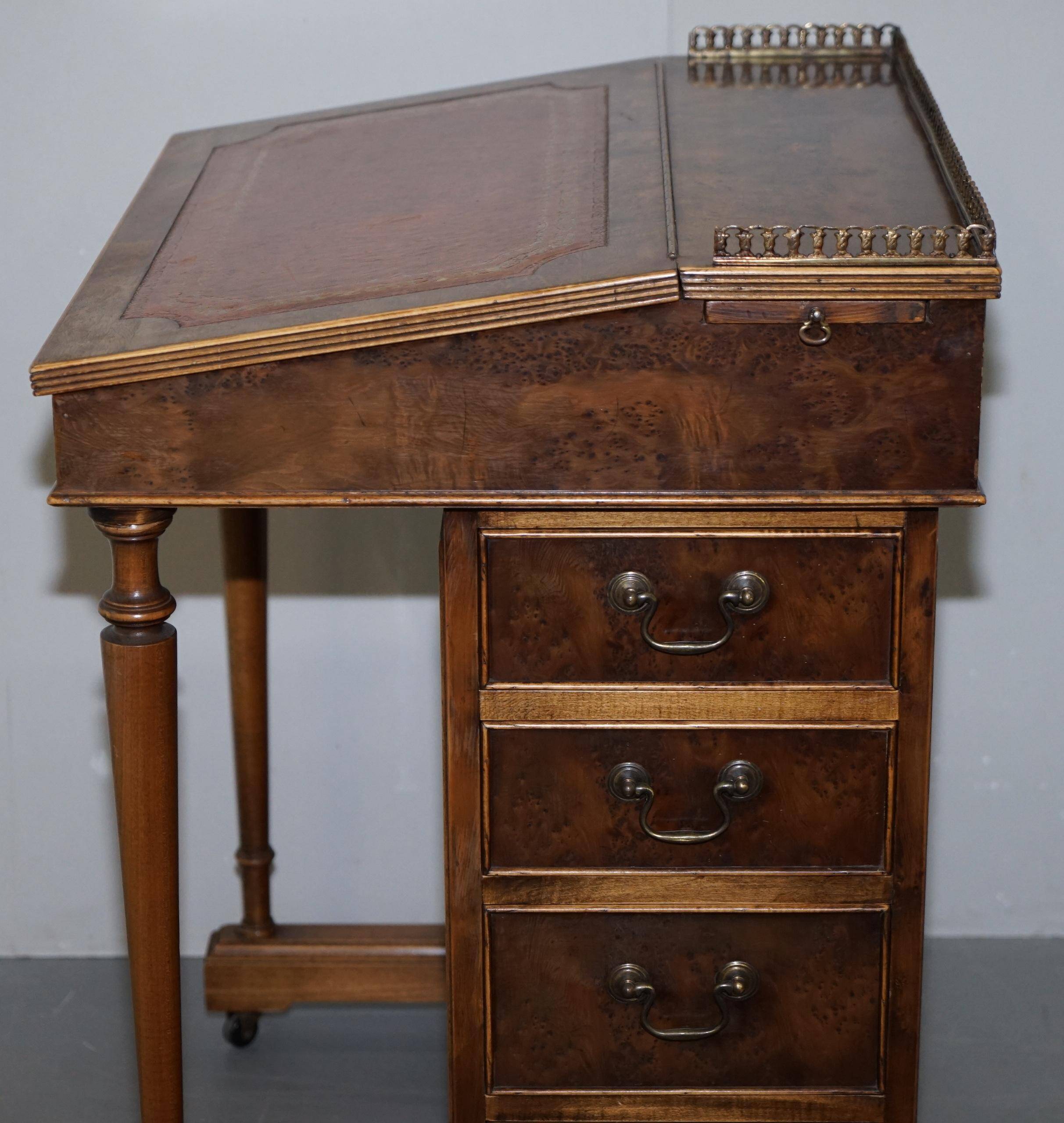 Davenport desk in walnut with leather and vintage brass gallery.