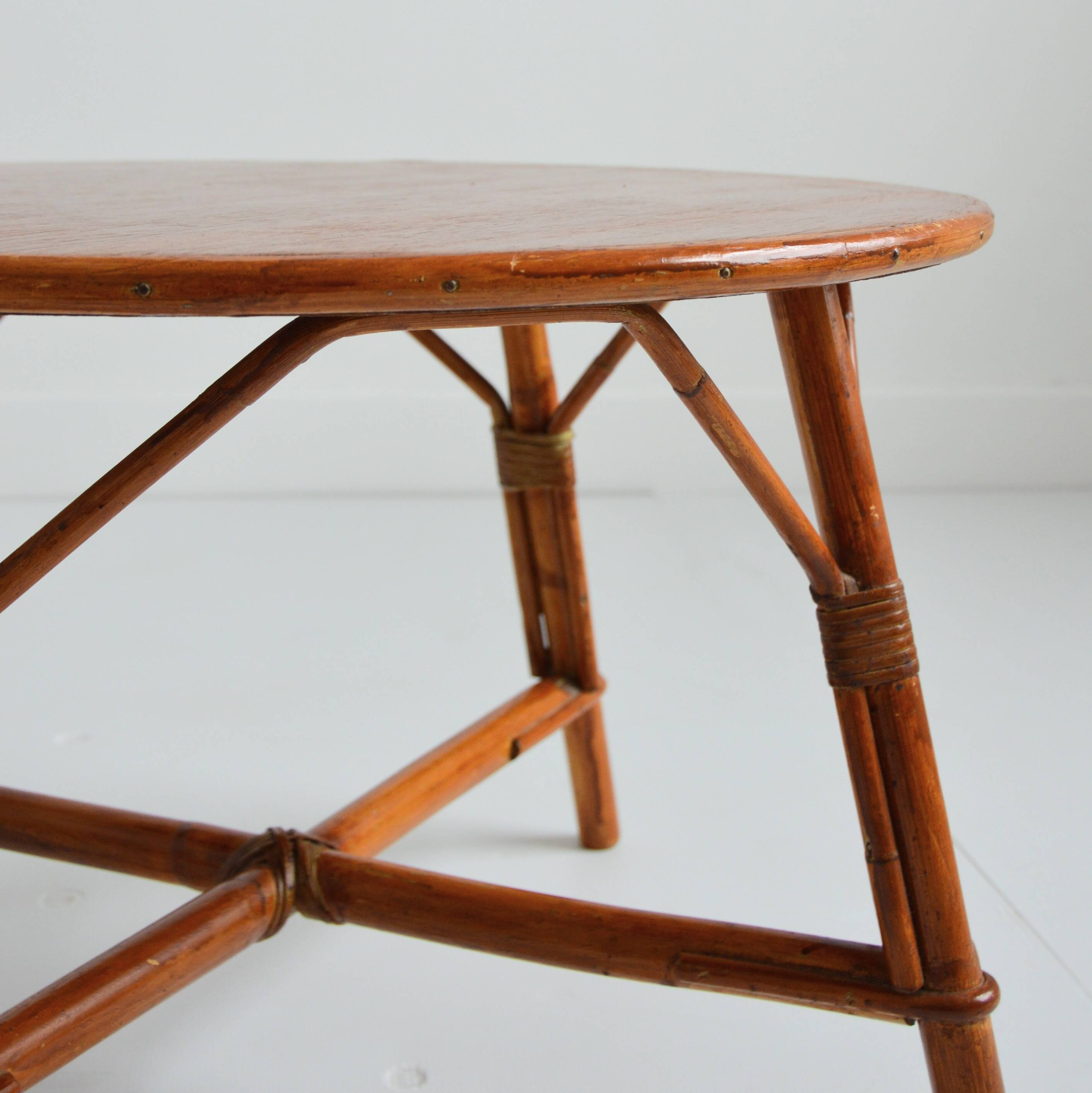 Vintage 1960s round wood and rattan coffee table