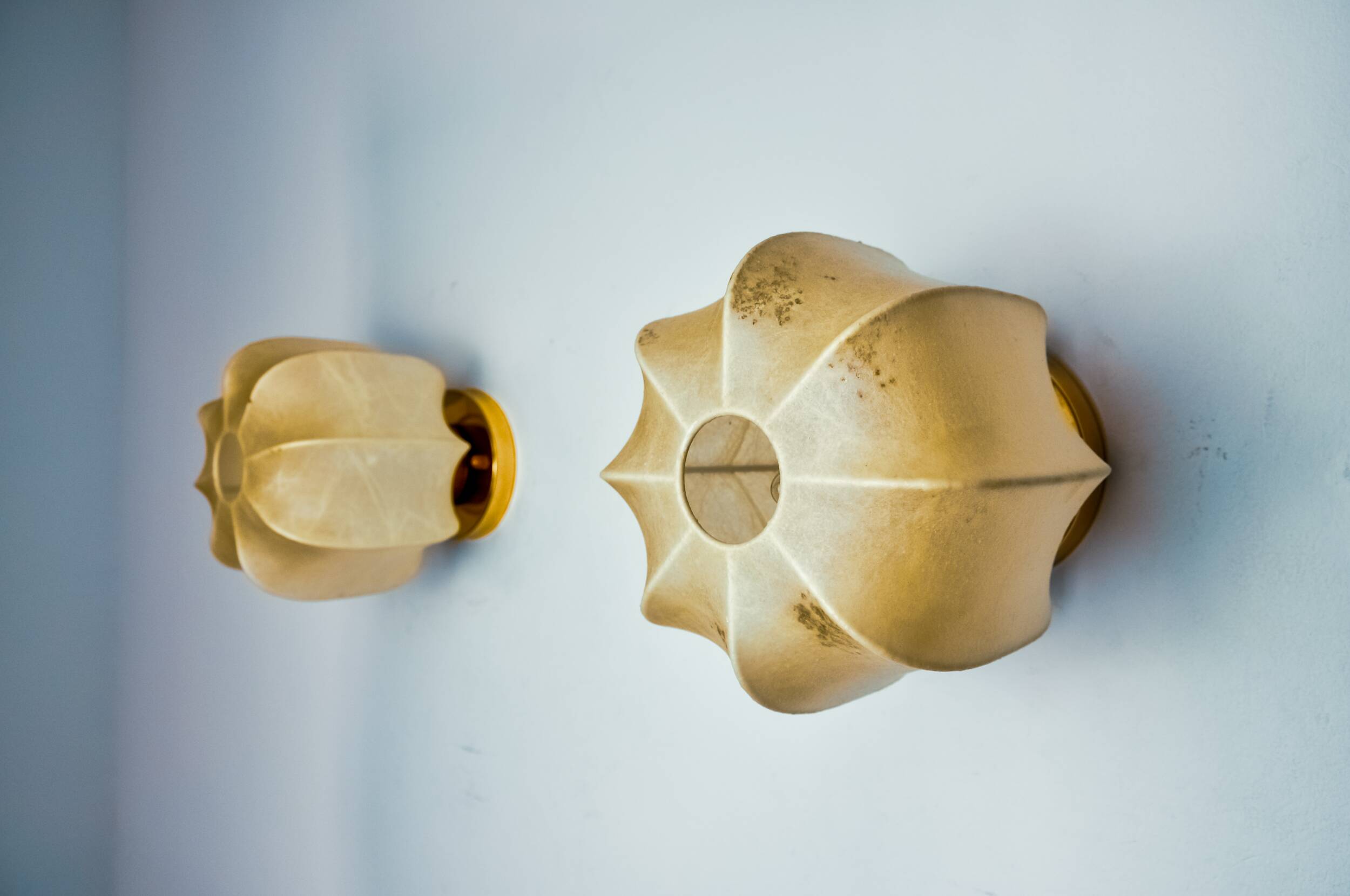 Pair of “cocoon” wall lights, resin and pine, italy, 1970