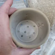 Beige stoneware cheese drainer