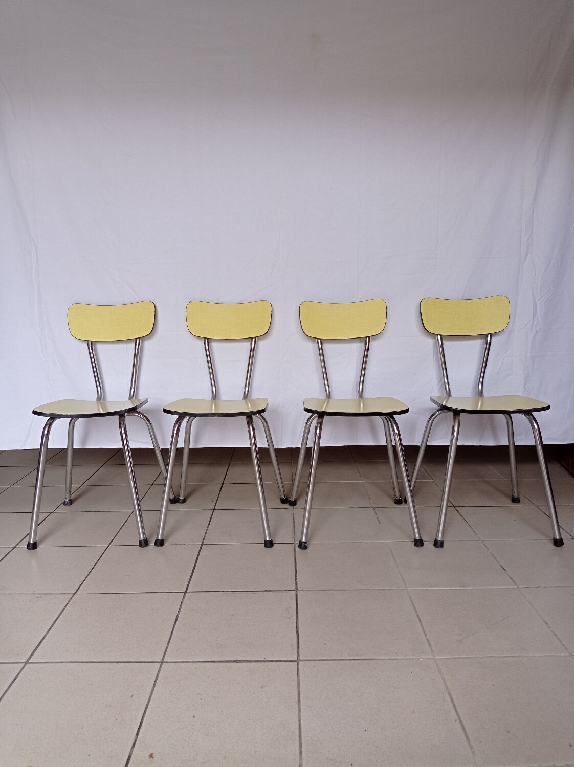 4 yellow Formica chairs