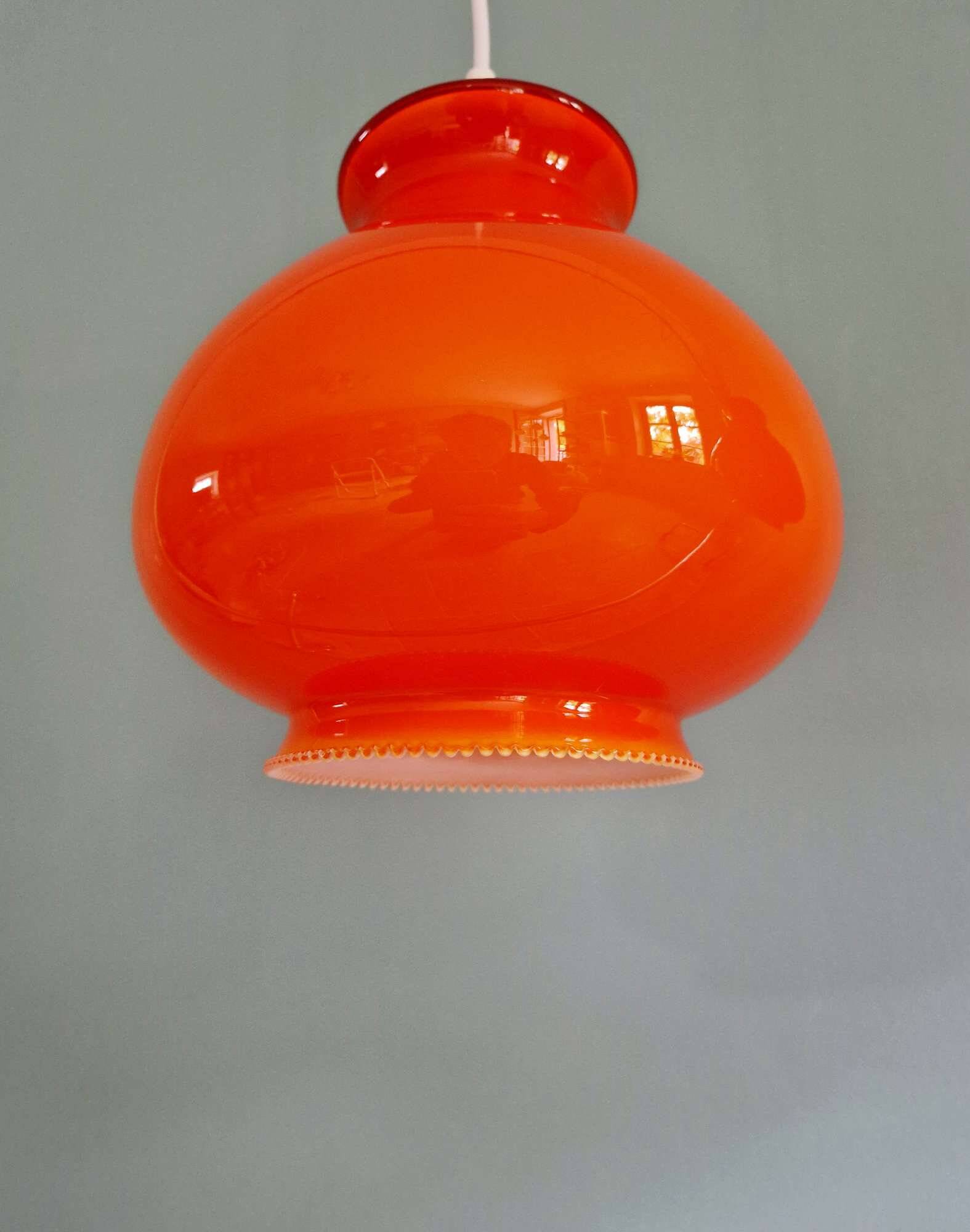 Trio of vintage orange opaline pendant lights, 1960-70