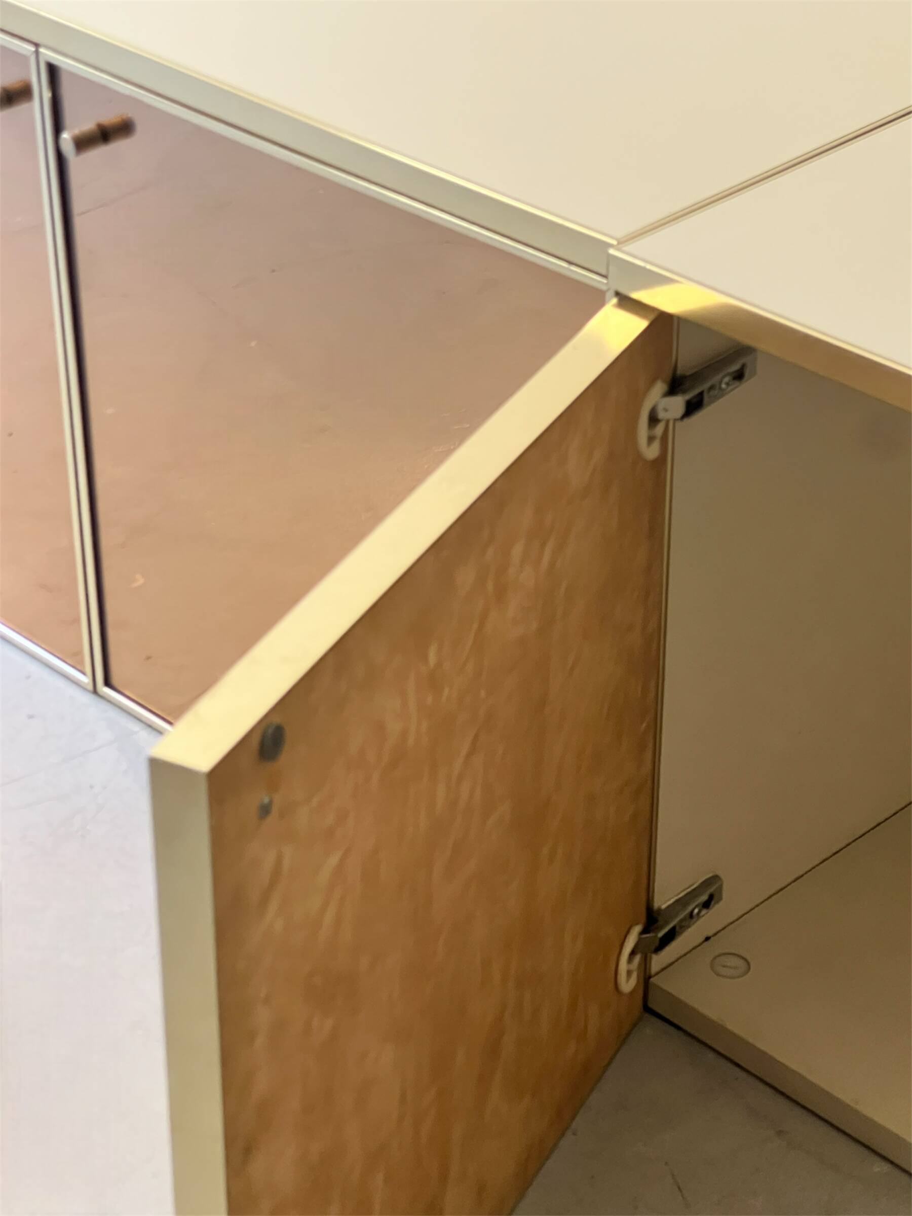 Low ivory lacquered enfilade, smoked mirror & brass JC Mahey, design 1970.