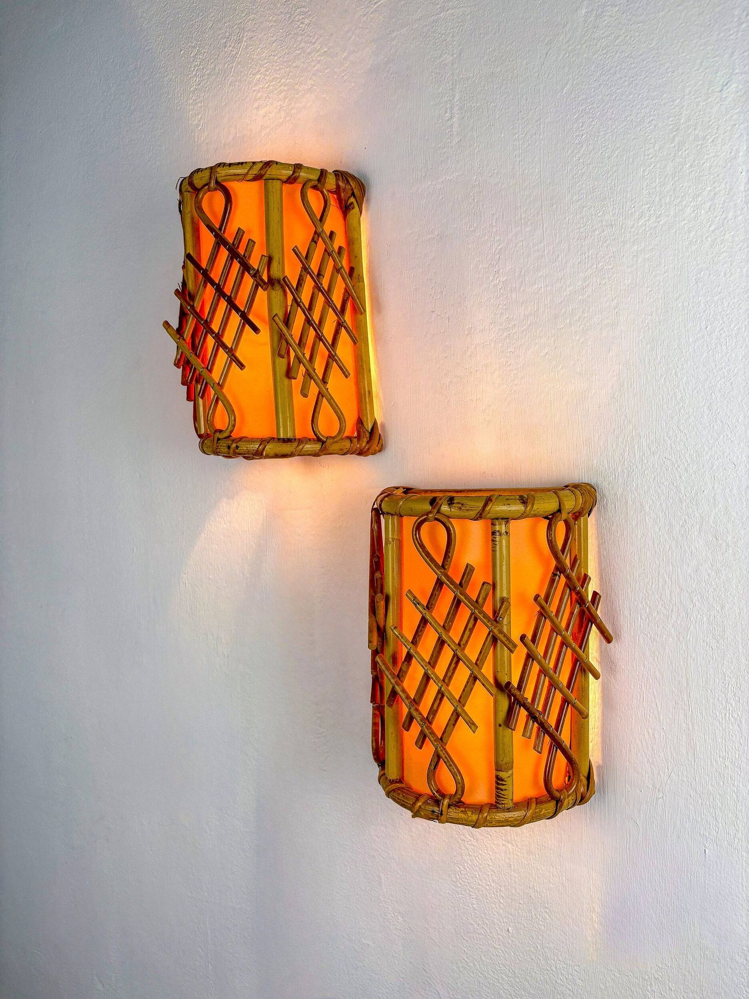 Pair of mid-century rattan wall sconces, circa 1970s, Italy