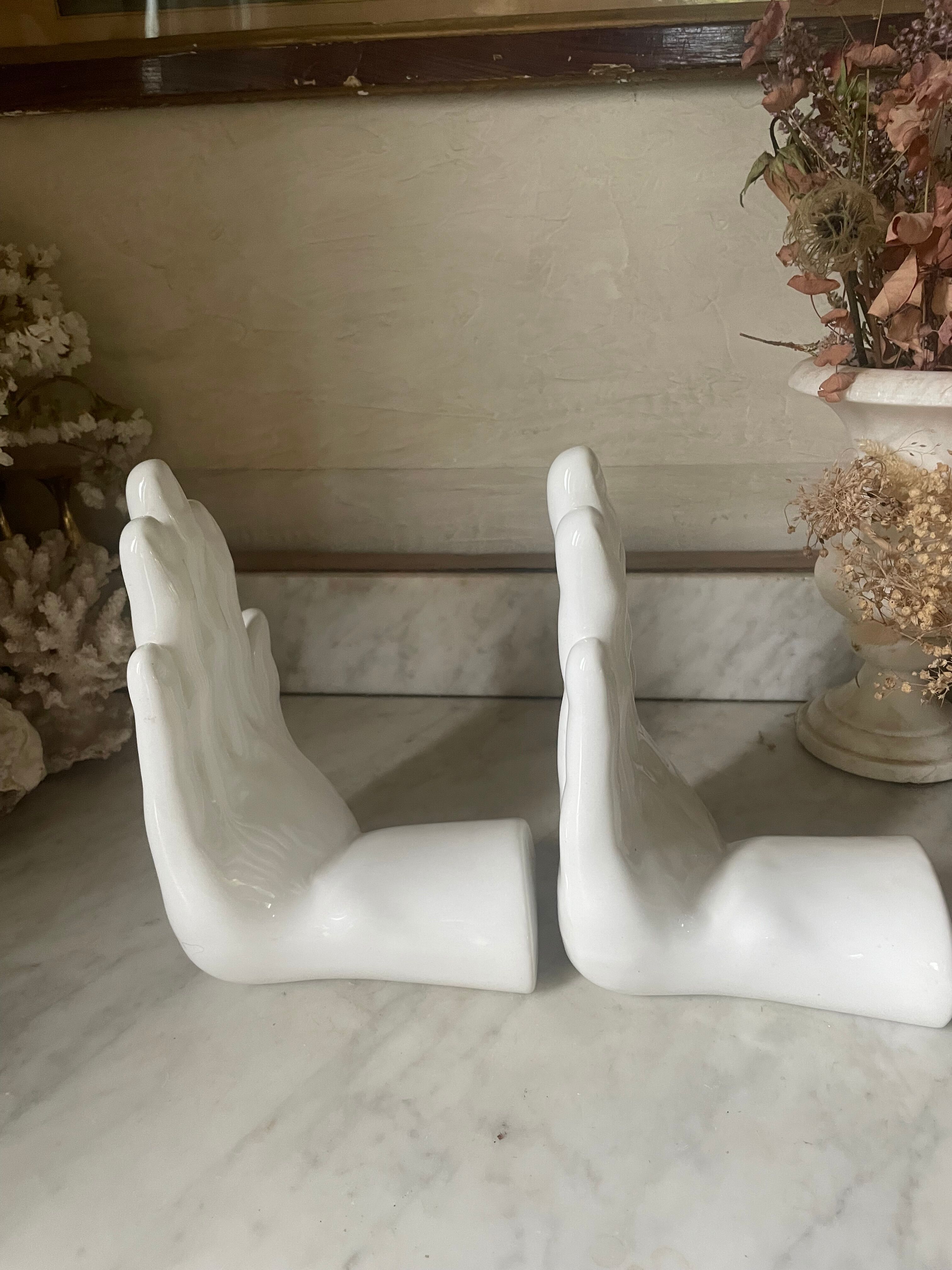 Pair of vintage Italian Mancer ceramic bookends, hands.