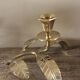 Brass candle holder with oval leaf branch