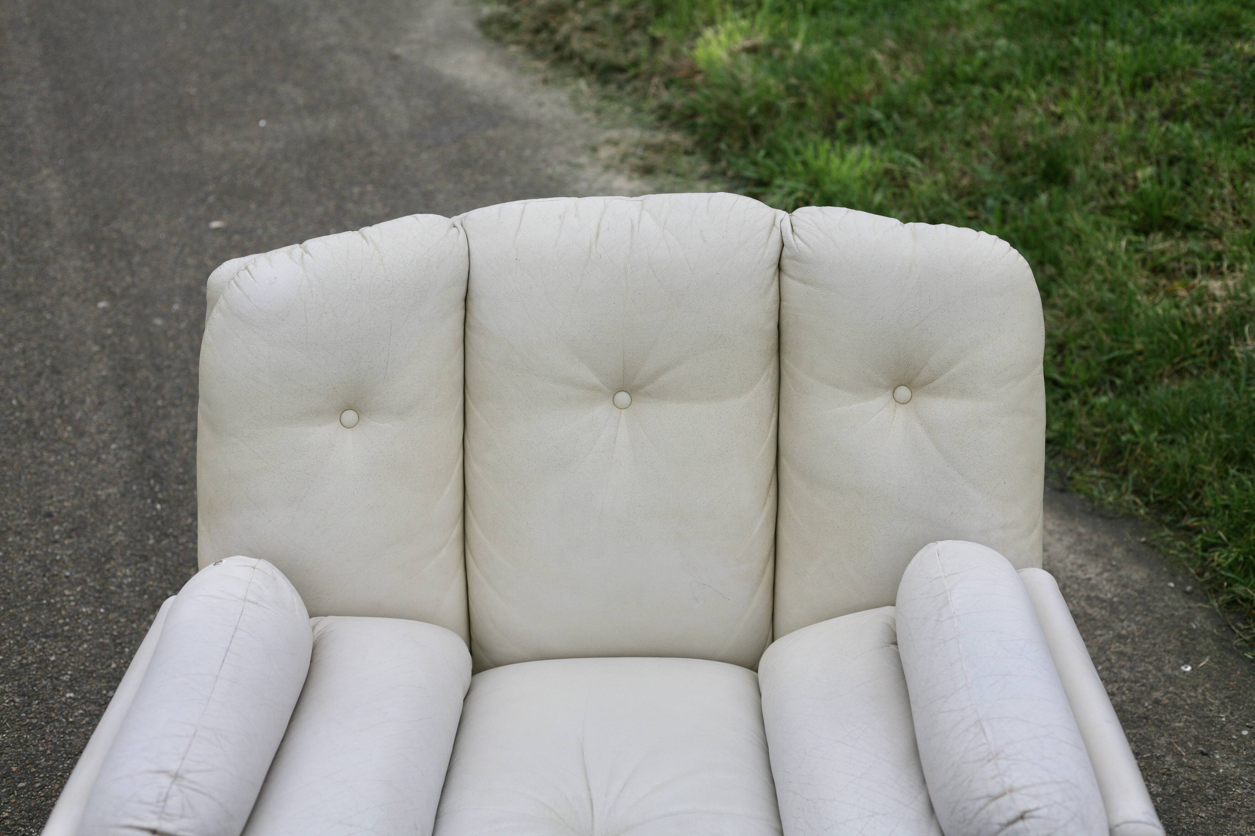 Pair of leather “space age” armchairs. Cream colour". Circa 1970.