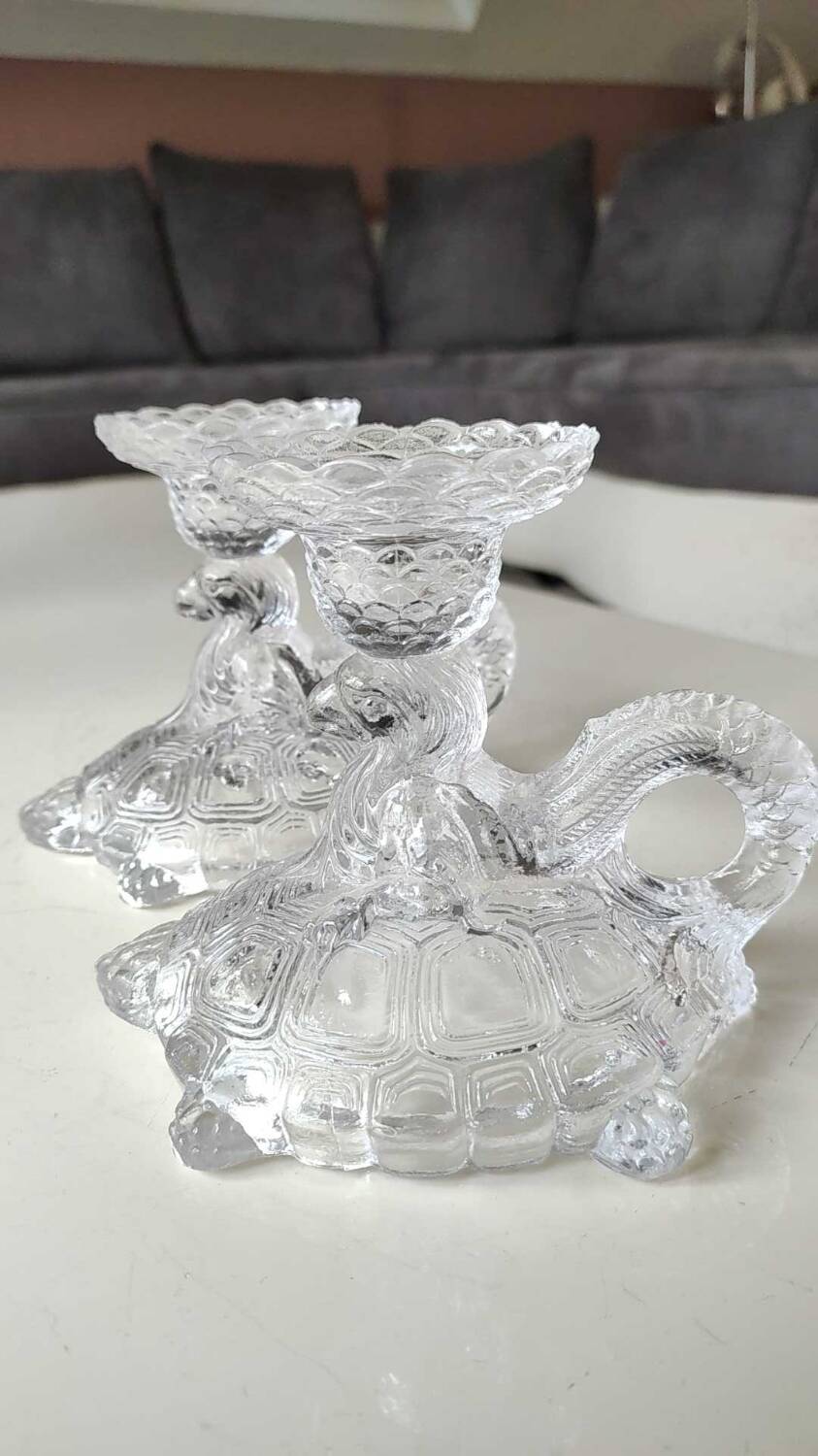 Pair of hand candlesticks/glassware from Portieux/Vallerysthal. In molded glass. Zoomorphic form of turtle carrying a griffin on its back.