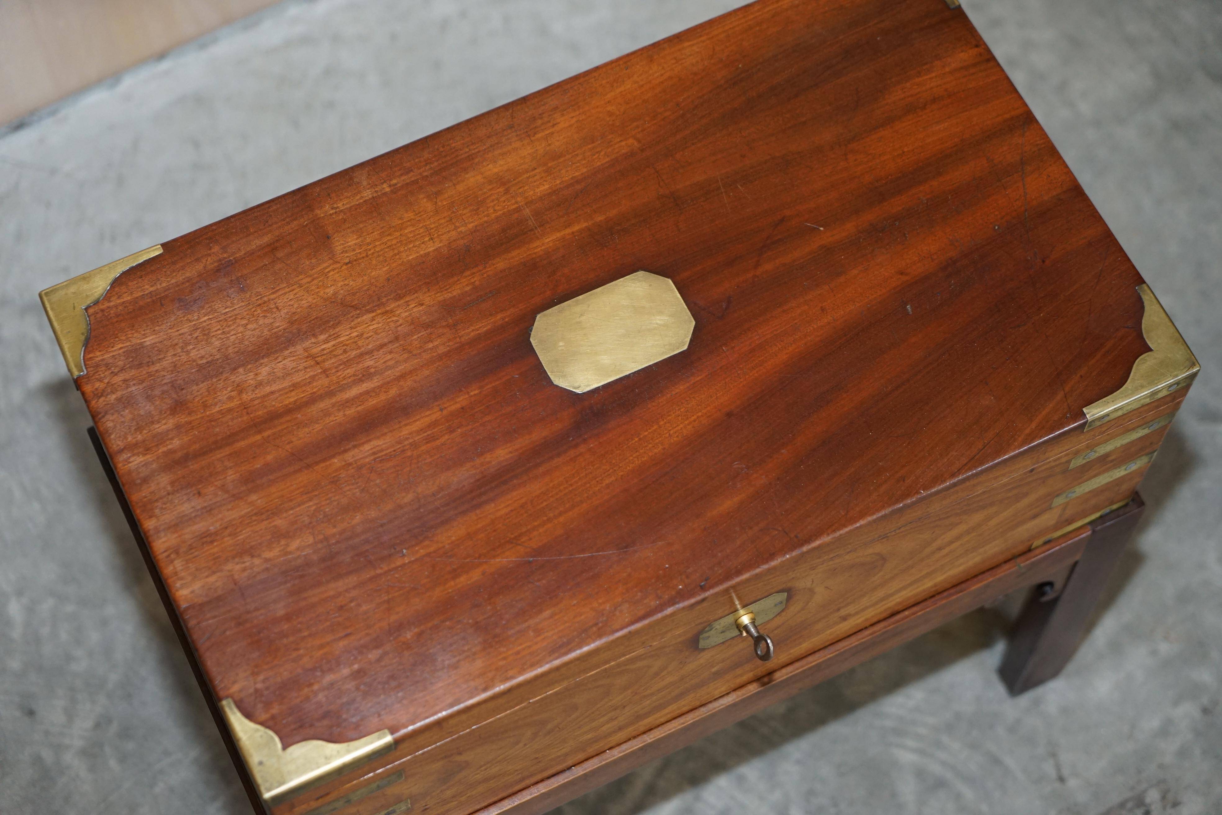 Antique hardwood military campaign desk with writing slope.