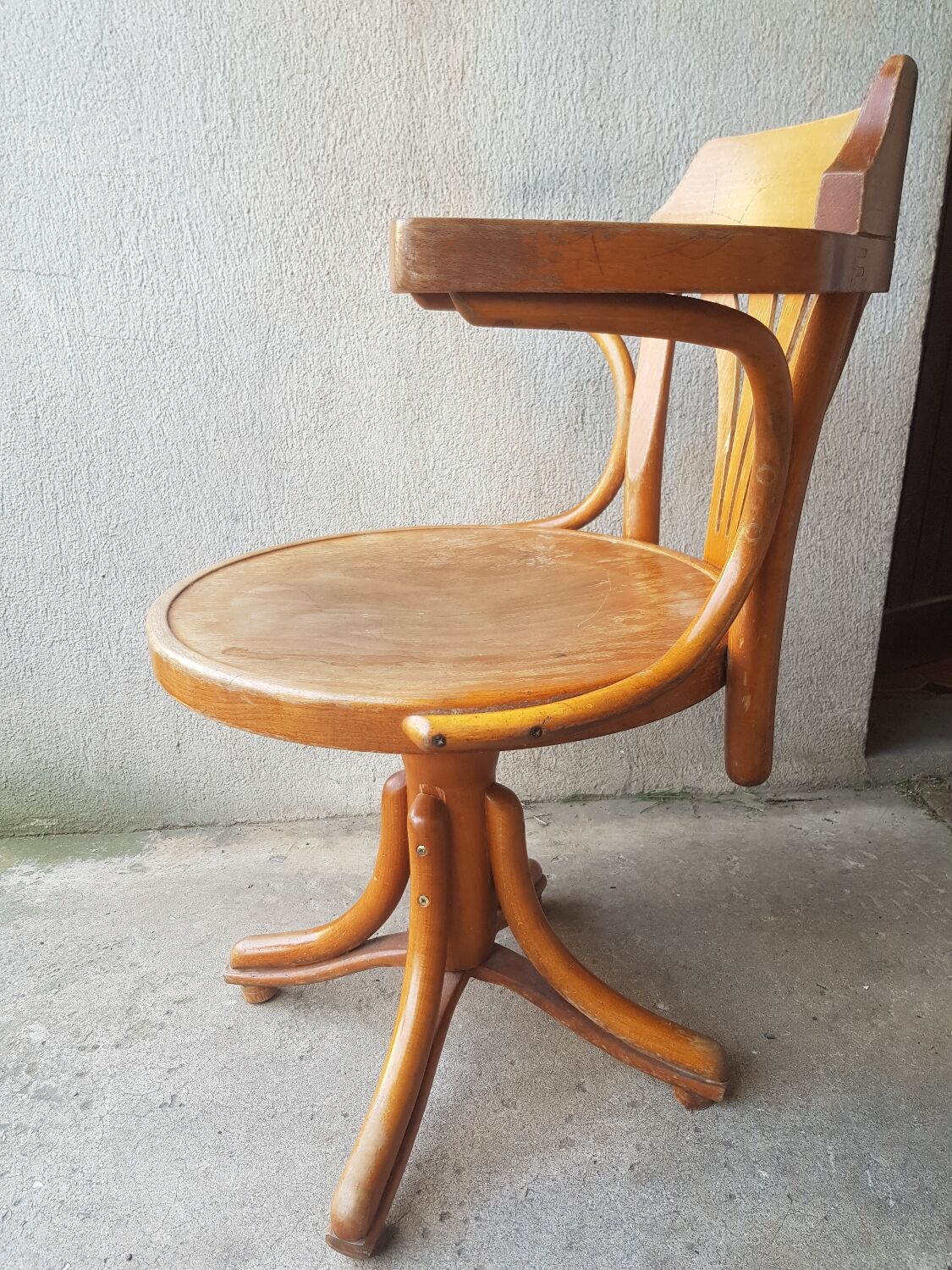 Swivel wooden armchair