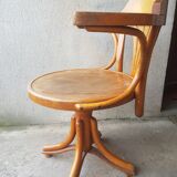 Swivel wooden armchair