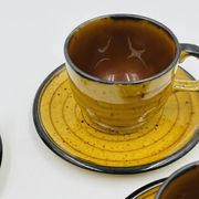 Set of four vintage Boch Palma cups and saucers.