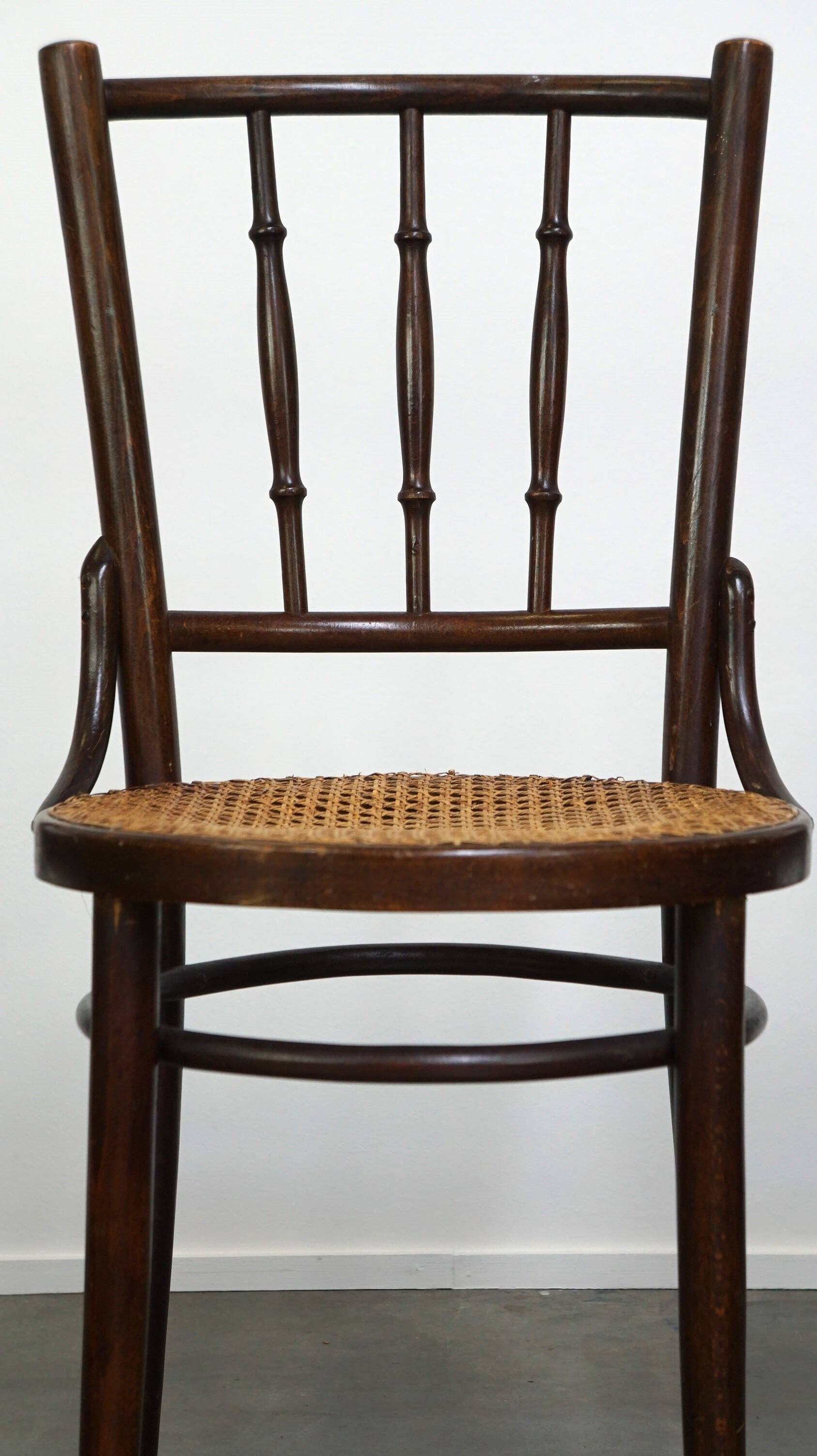 4 antique wooden and cane bistro chairs
