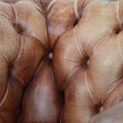 Chesterfield armchair in English style made of cowhide leather