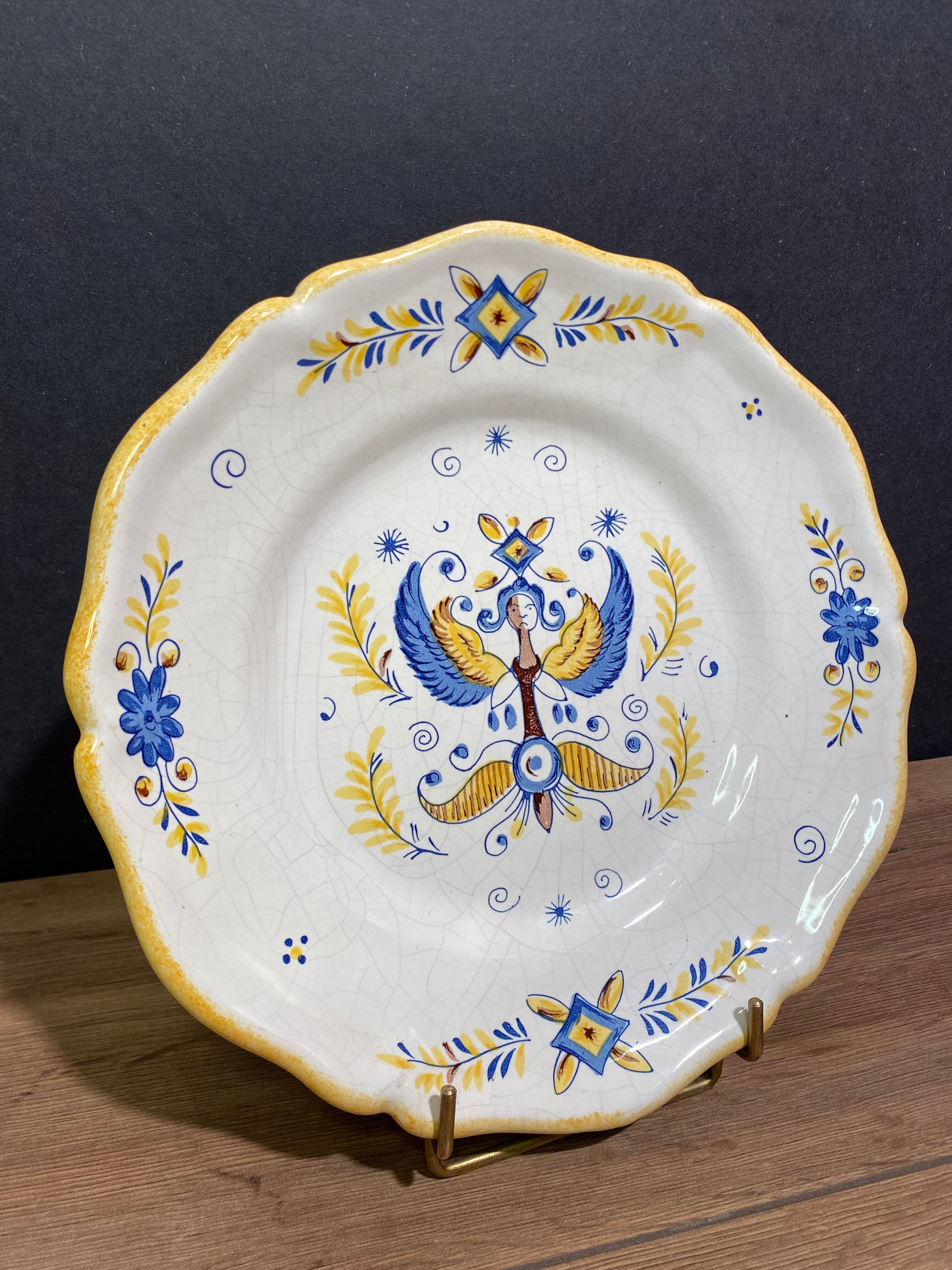 Earthenware plate decorated with winged character decoration in Nevers style, Auxerrois