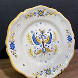 Earthenware plate decorated with winged character decoration in Nevers style, Auxerrois