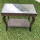 Carved wooden quadrupedal pedestal table