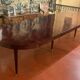 Directoire period extendable dining table in mahogany with a band.