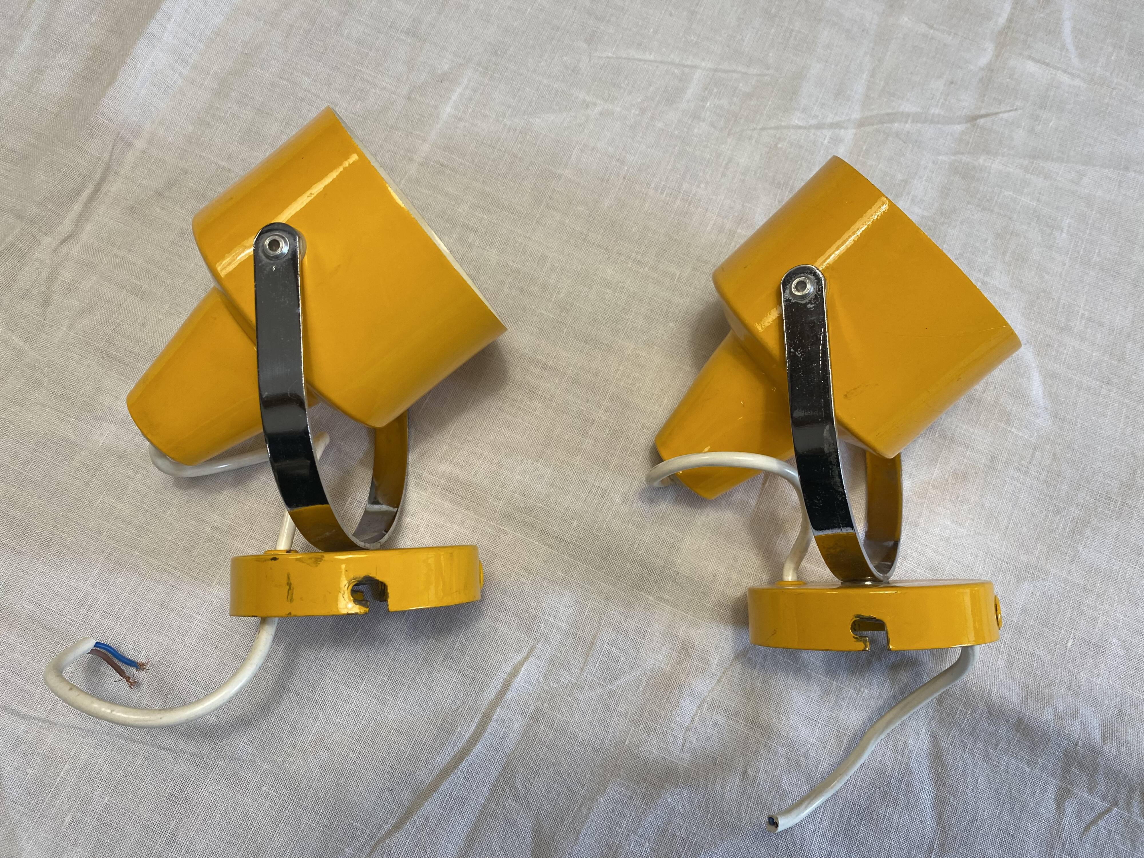 Pair of adjustable vintage wall lamps in yellow and chrome metal. Year 60