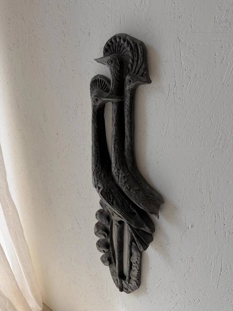 Brutalist wall sculpture with birds Ars Munda