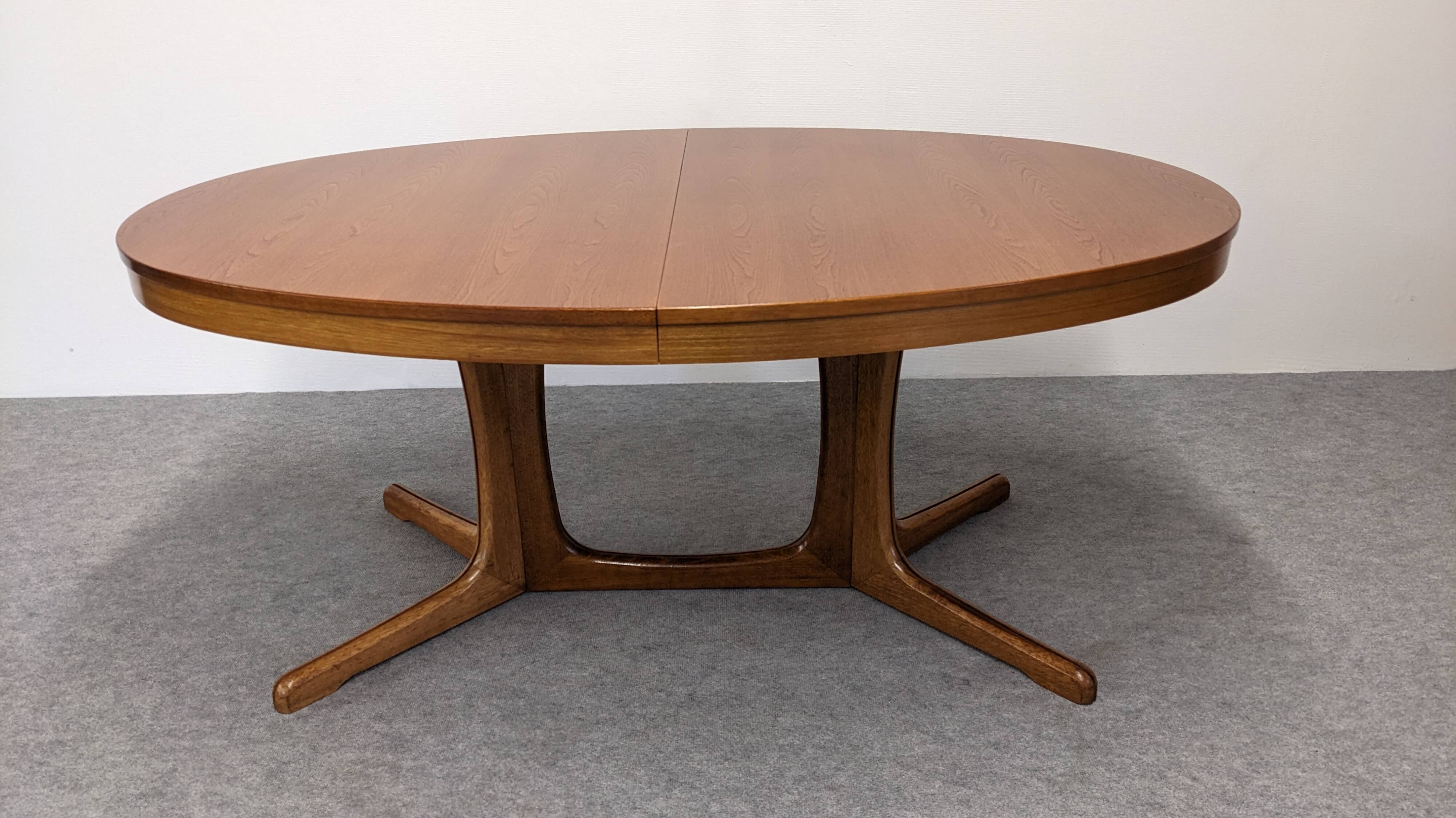 Oval extendable dining table by Baumann, France circa 1970.