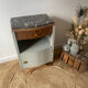 Pair of mismatched art deco bedside tables in green and wood