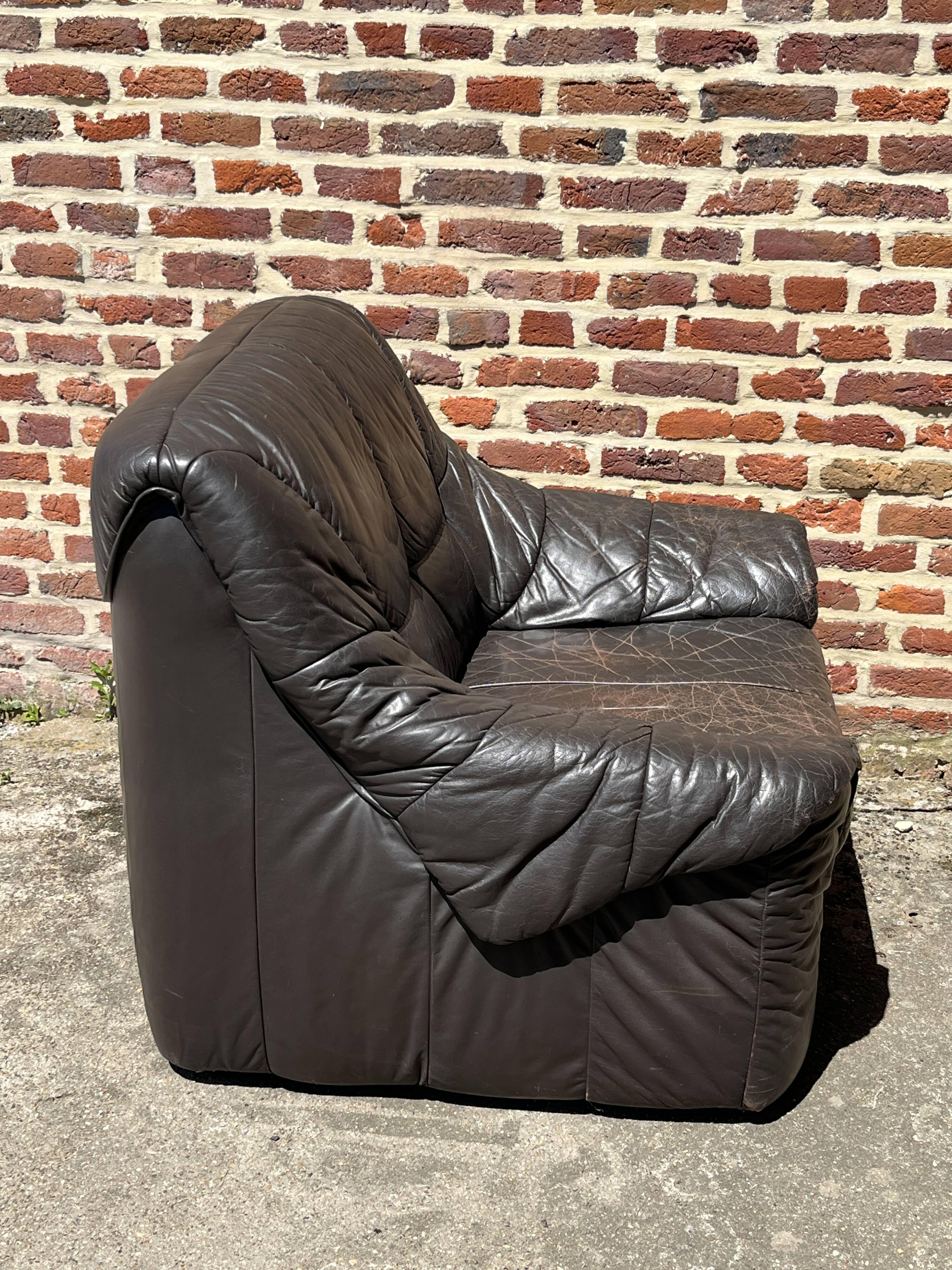 Pair of patinated leather club armchairs
