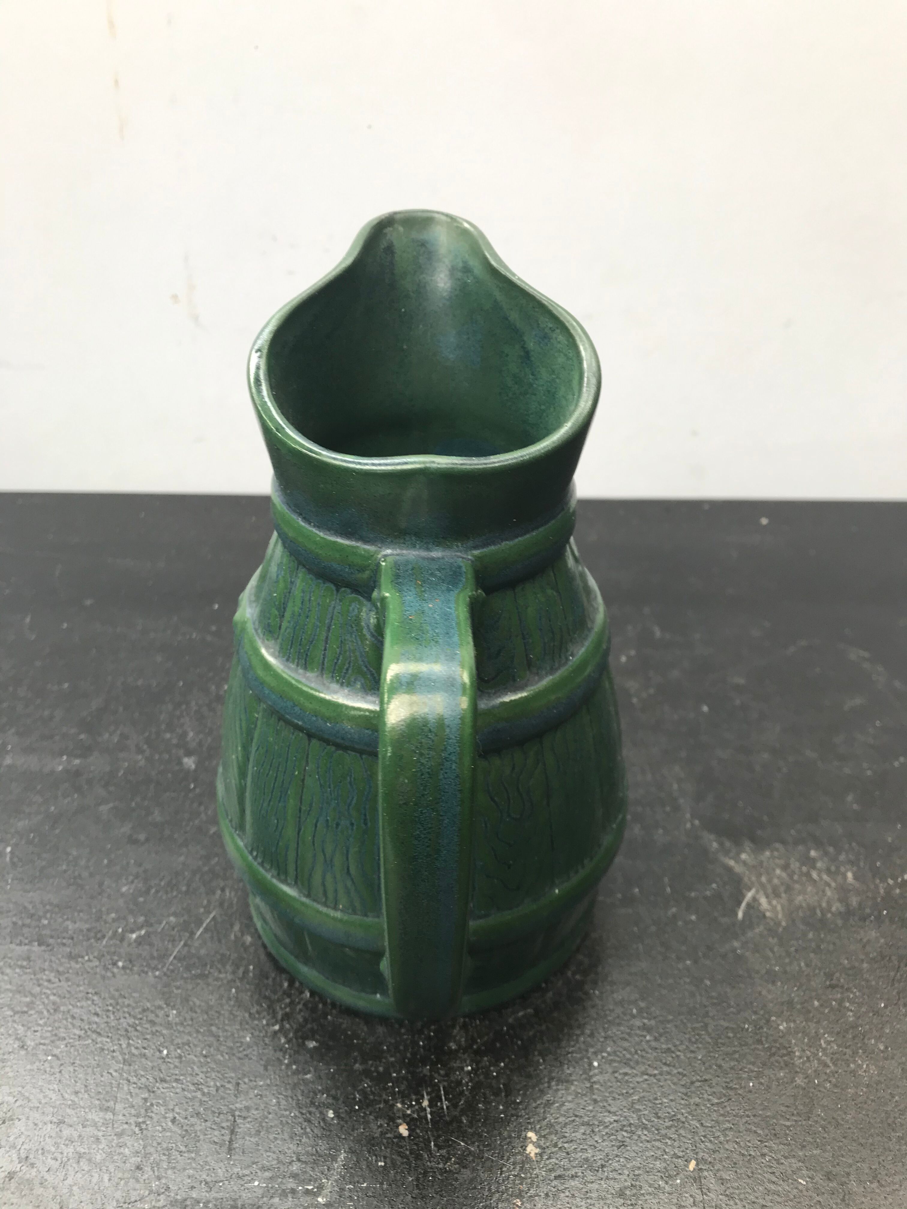 Former green ceramic pitcher shape tonneau