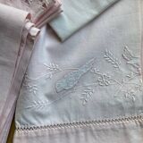 Set of embroidered baby bed sheets