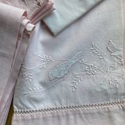 Set of embroidered baby bed sheets