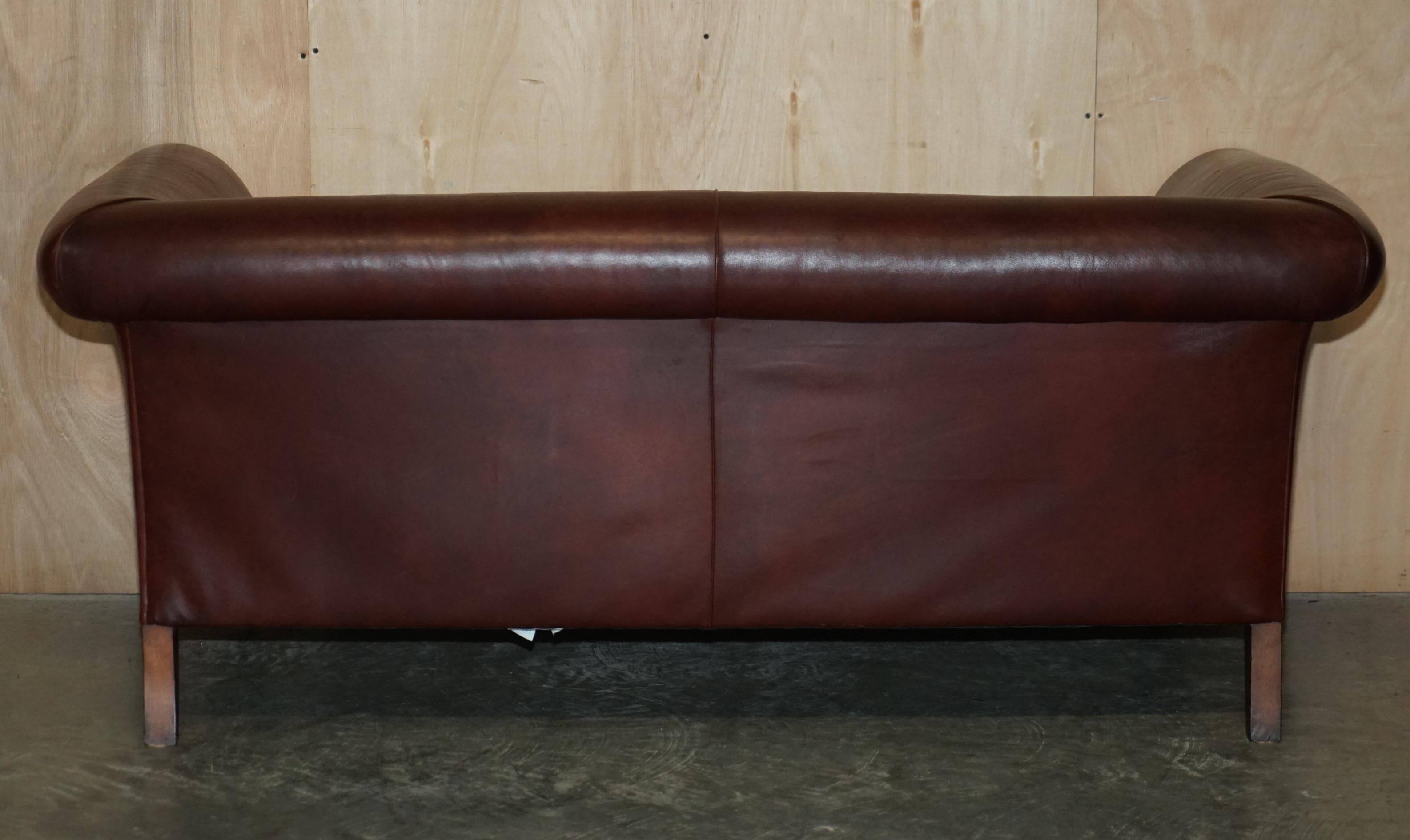 Vintage Art Deco leather sofa, three-seater, feather cushions.
