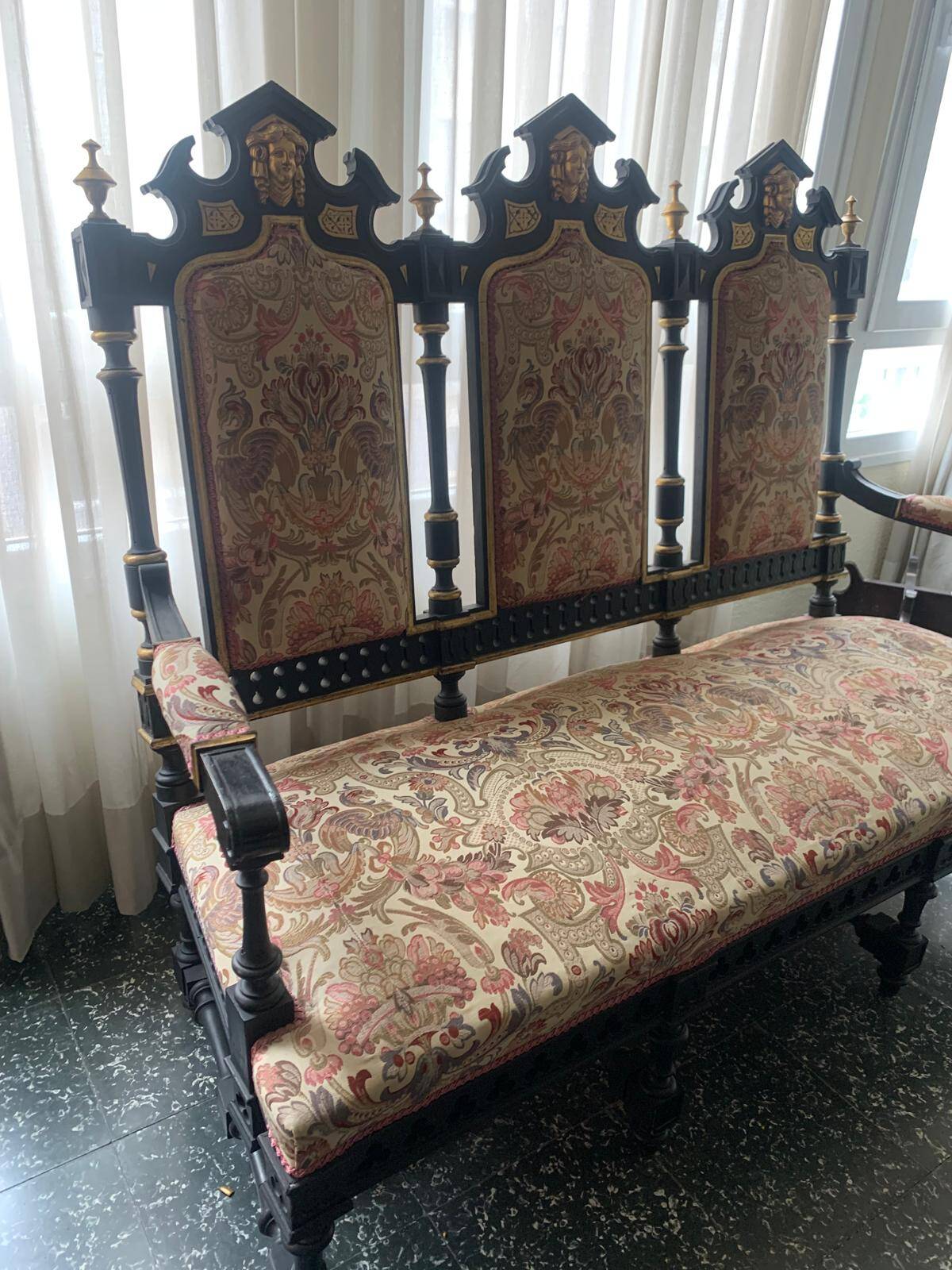 Historicist three-seater canapé in ebonised wood.