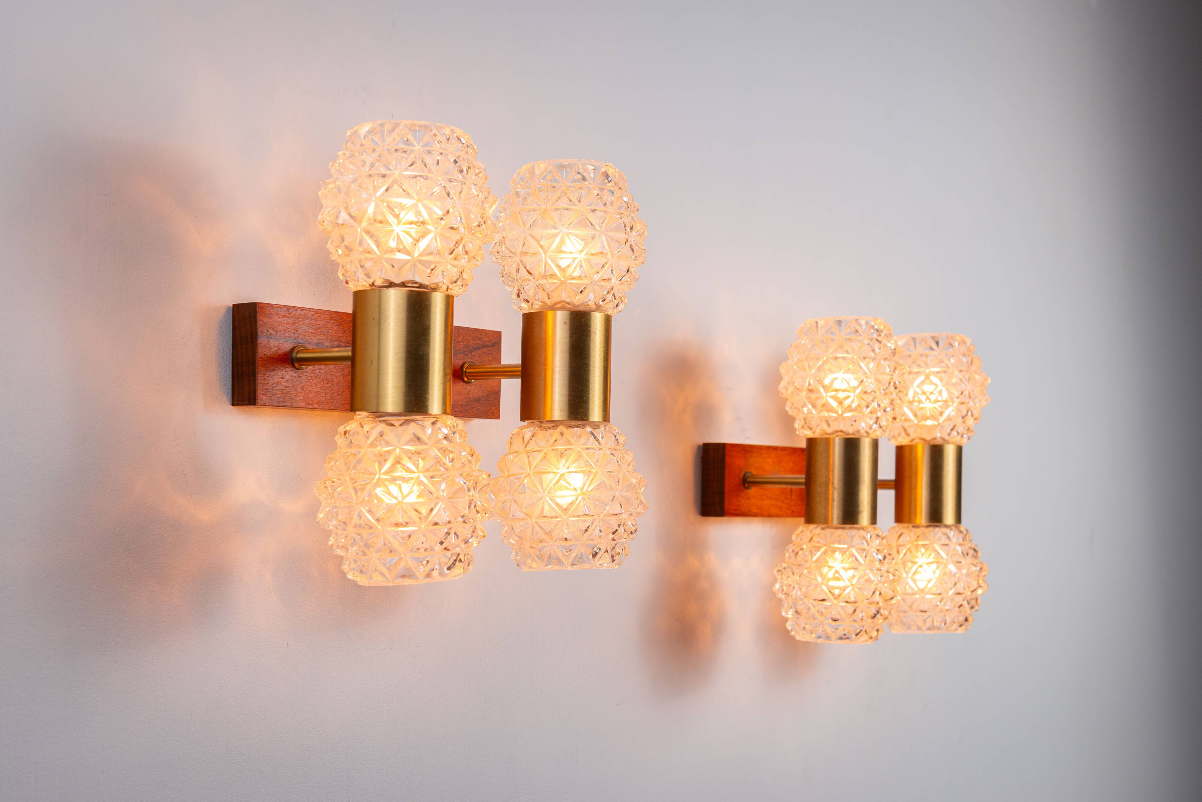 Pair of Swedish wall lamps with teak wood, brass and glass cup shade