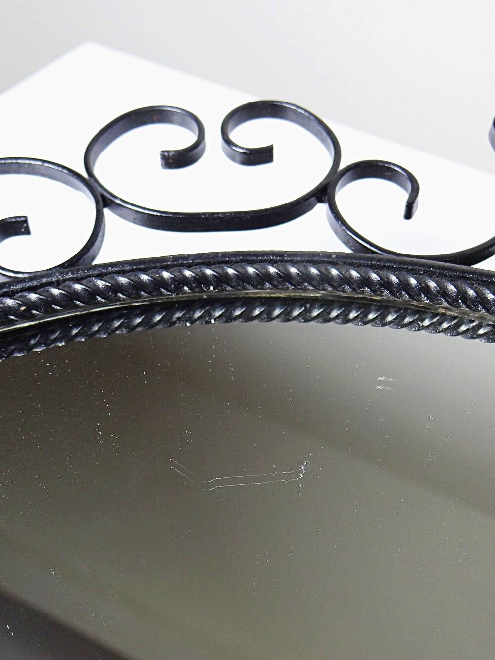 Vintage round wall mirror from the 60s and 70s, wrought iron arabesques
